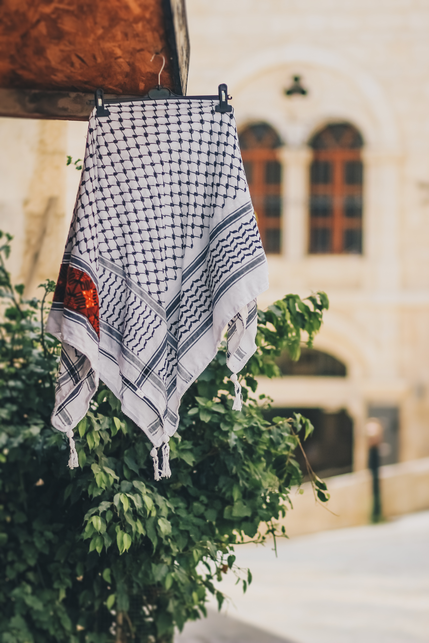 photo of keffiyeh presented in the Traditional Arabic shop in bethlehem. Palestinian traditional symbolic arabian scarf Kufiya